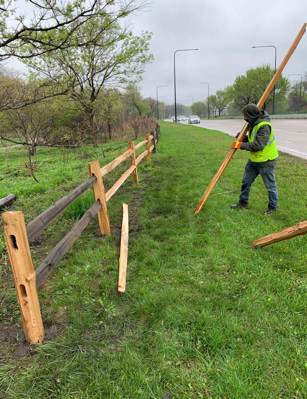 Newly installed split rail fence along a lot line